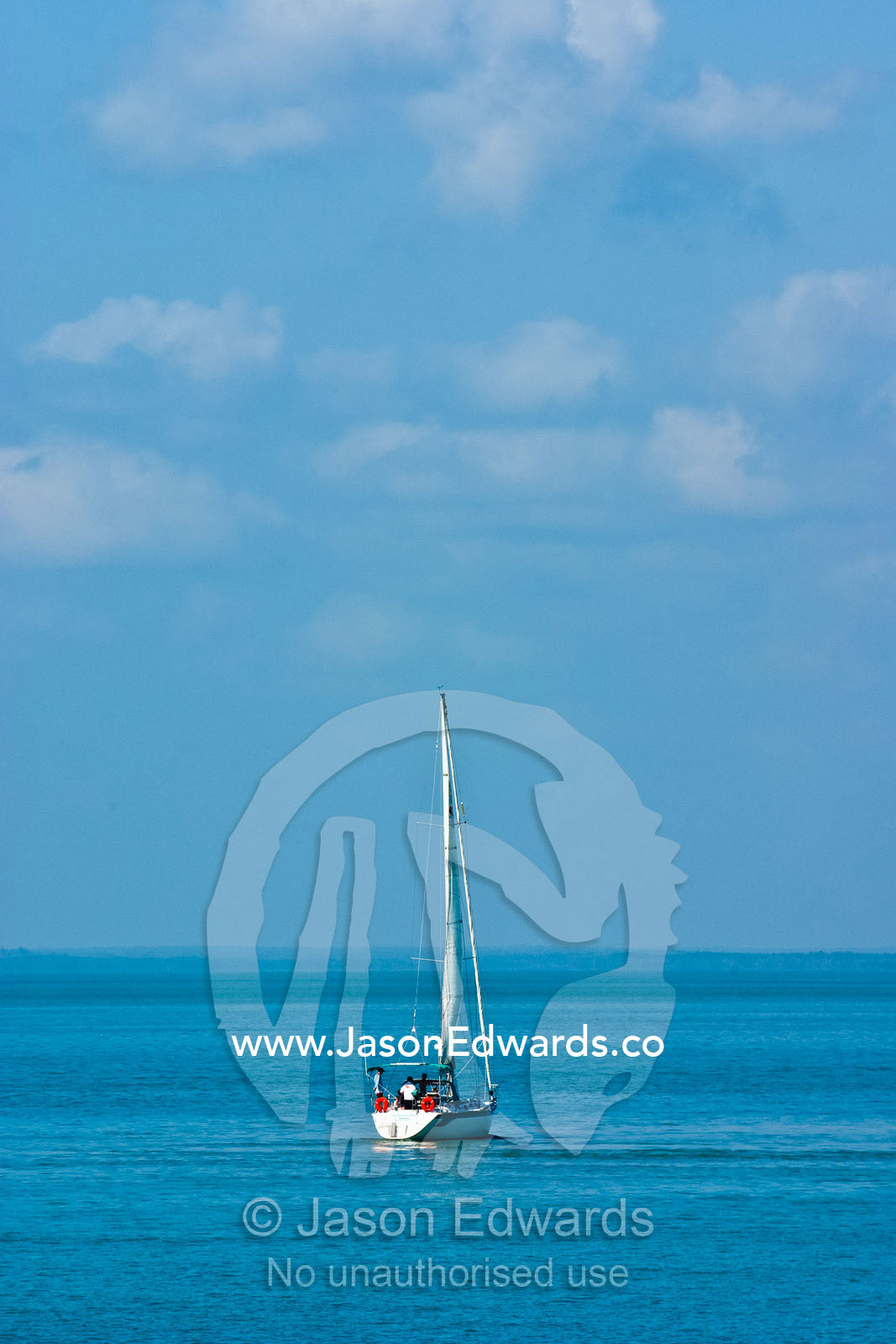 A white yacht sails the calm turquoise waters of the Arafura Sea. Arafura Sea, Darwin, Northern Territory, Australia