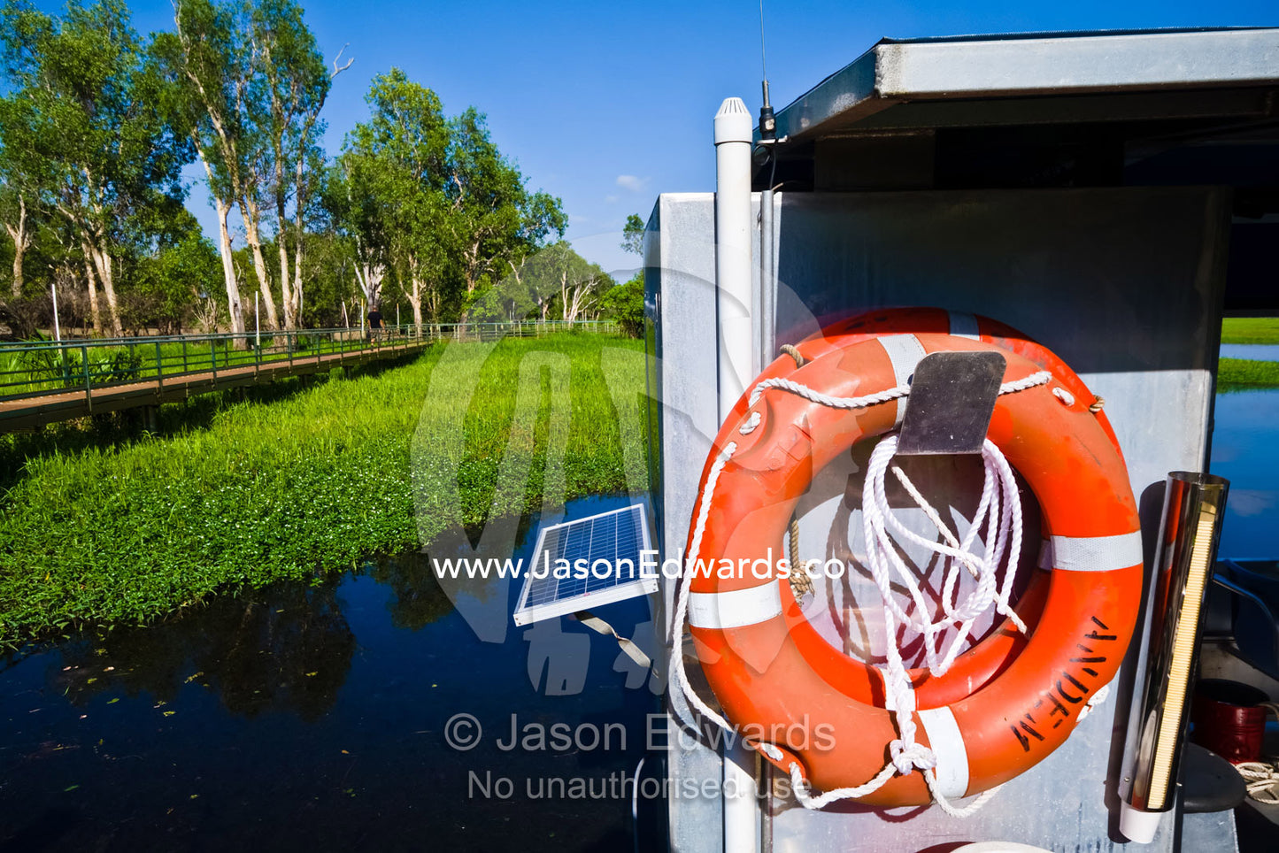 A bright red rescue ring used for emergencies on a sightseeing boat. Yellow Waters, Kakadu National Park, Northern Territory, Australia