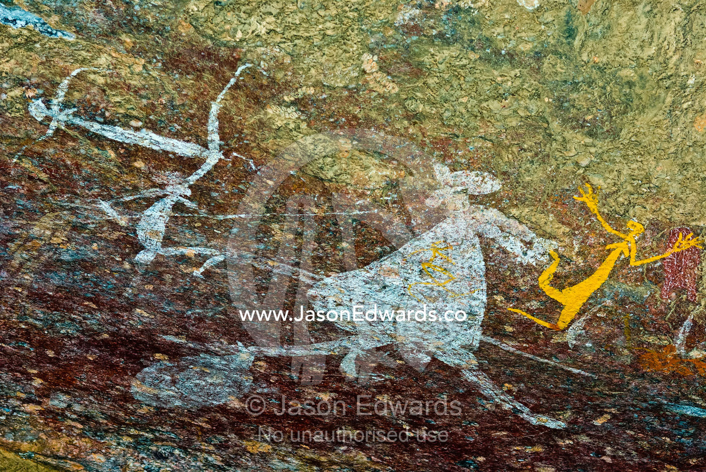 Aboriginal rock art depicts figures hunting a kangaroo with spears. Nourlangie, Nawurlandja, Anbangbang Billabong, Kakadu National Park, Northern Territory, Australia.