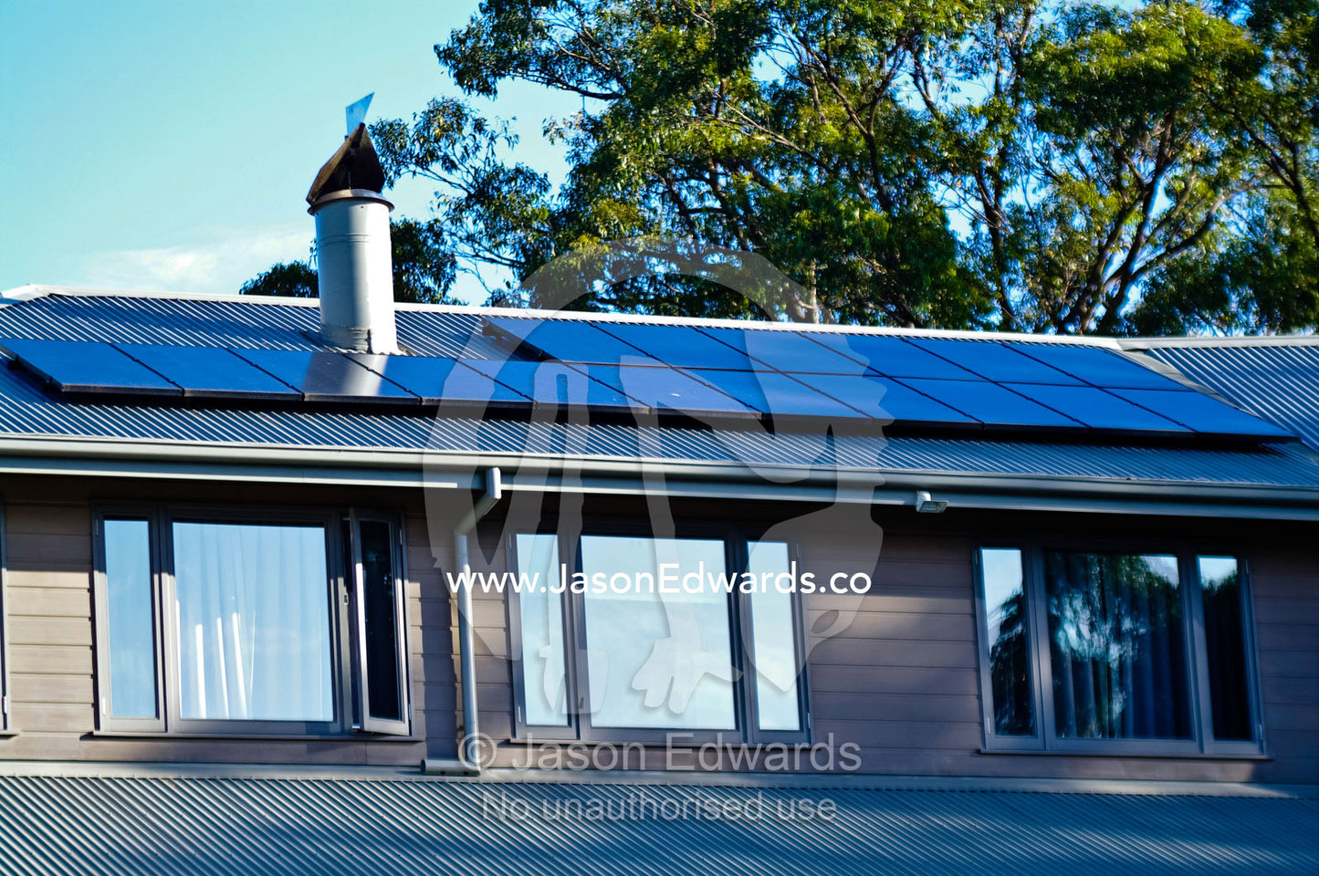 Solar panels on the roof of a homestead provide electrical energy. Red Hill, Mornington Peninsula, Victoria, Australia.