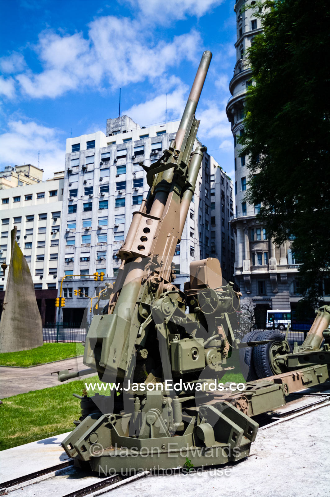 A camouflaged army cannon in the forecourt of the Libertador Building. The Libertador Building, Edificio Libertador, Buenos Aires, Argentina.
