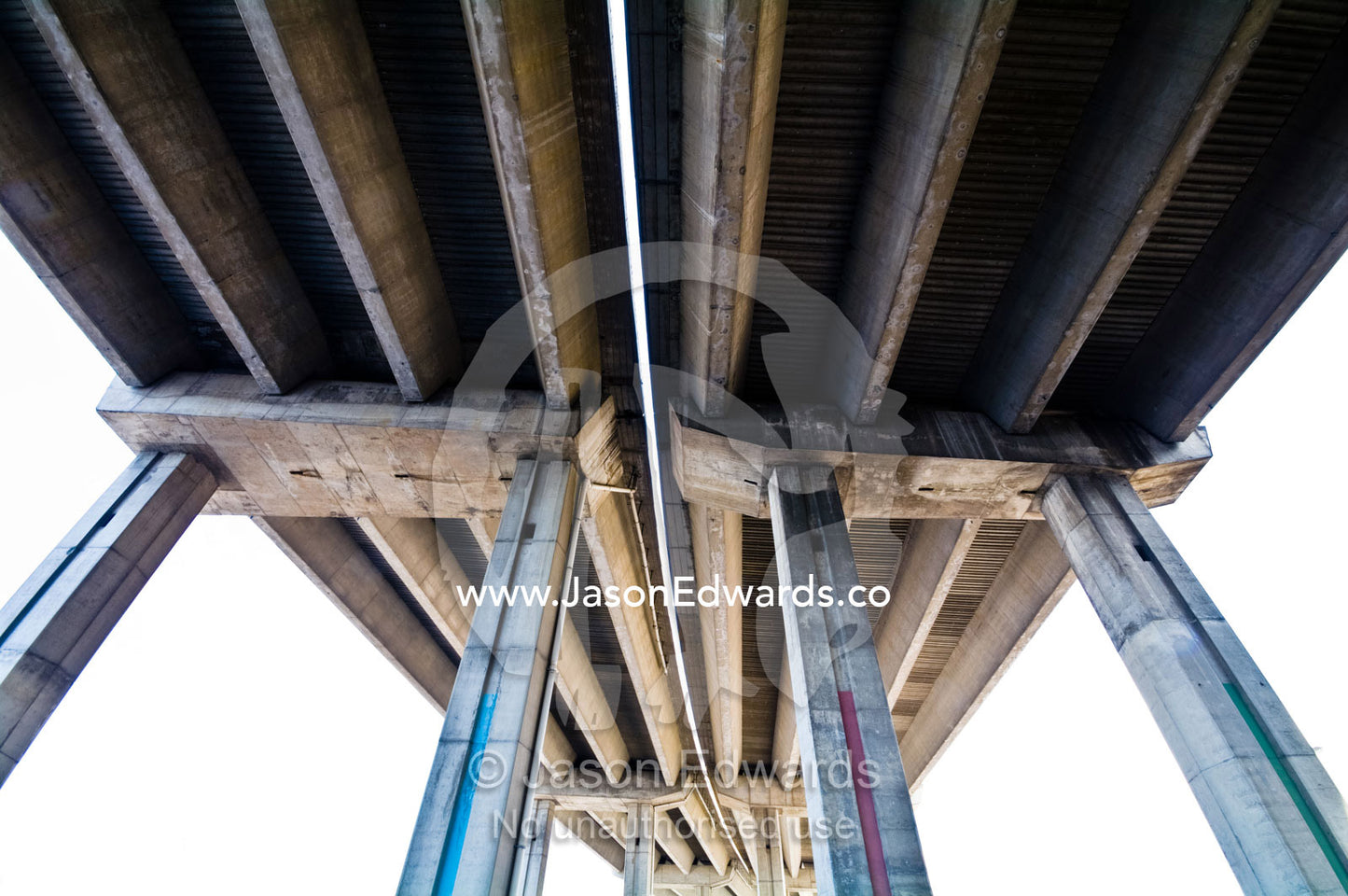Enormous grey ribbed support vaults of a concrete freeway overpass. La Boca, Buenos Aires, Argentina.