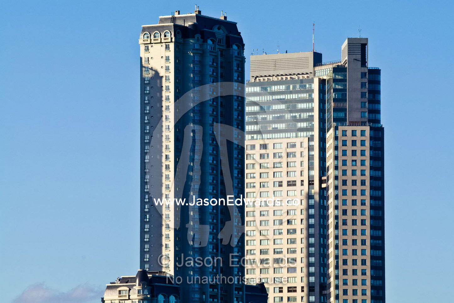 Modern highrise apartment towers rise into a clear blue sky. Puerto Madero, Buenos Aires, Argentina.
