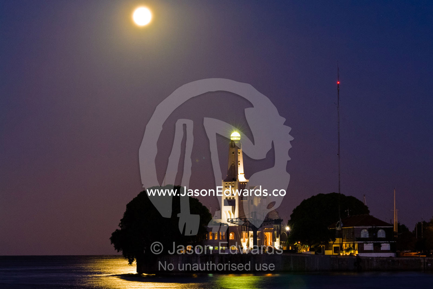 A pastel moonrise over a tree-lined river harbour wall and yacht club. Yacht Club Argentino, Viamonte y R��o de la Plata D��rsena Norte, R��o de la Plata, River of Silver, Puerto Madero, Buenos Aires, Argentina