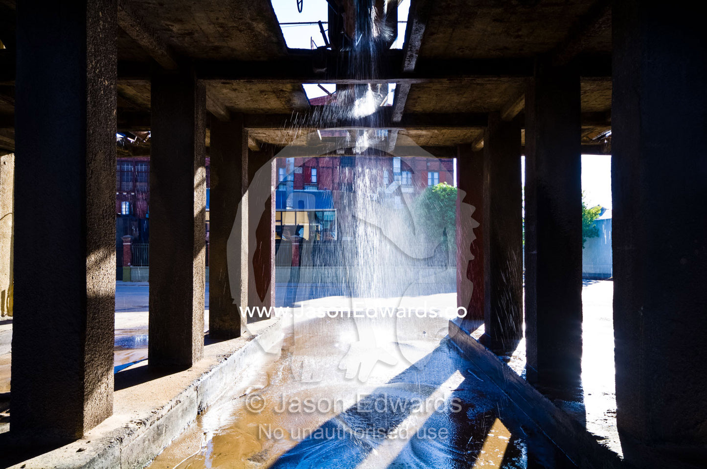 Water washes river sand for cement construction in a special dredge. La Boca, Buenos Aires, Argentina.