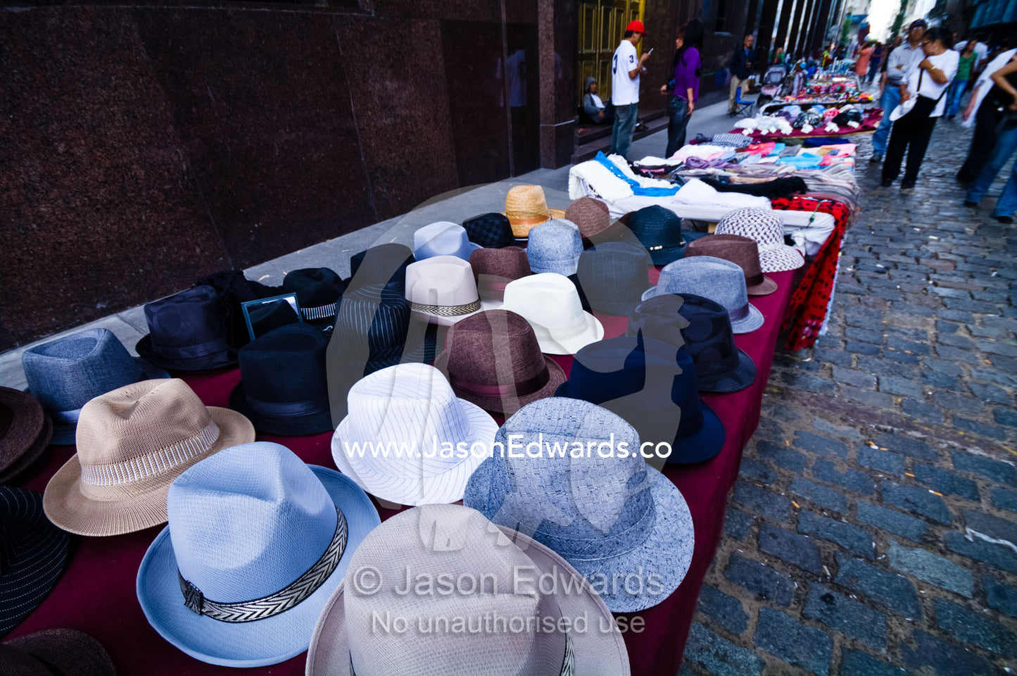 Tango hats for sale in a market stall in a cobblestone city lane. Plaza de Mayo, Buenos Aires, Argentina.
