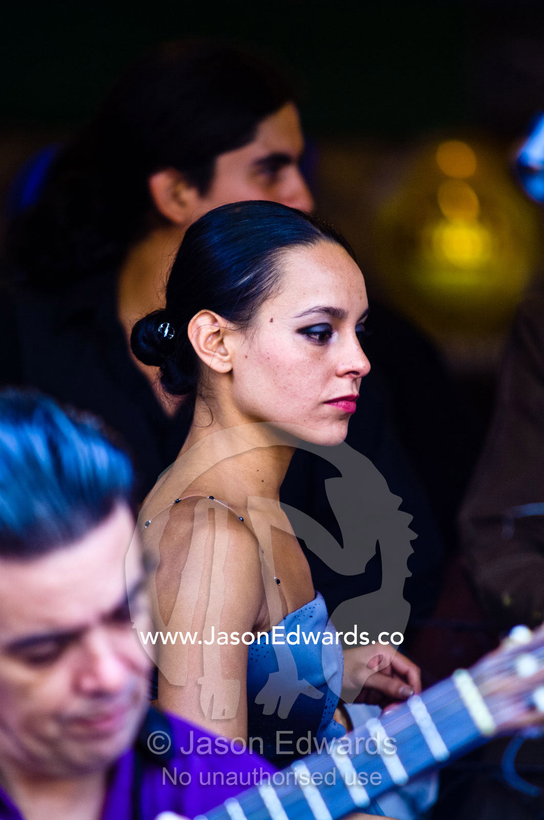 Intense concentration on the face of a beautiful young Tango dancer. El Caminito, La Boca, Buenos Aires, Argentina.