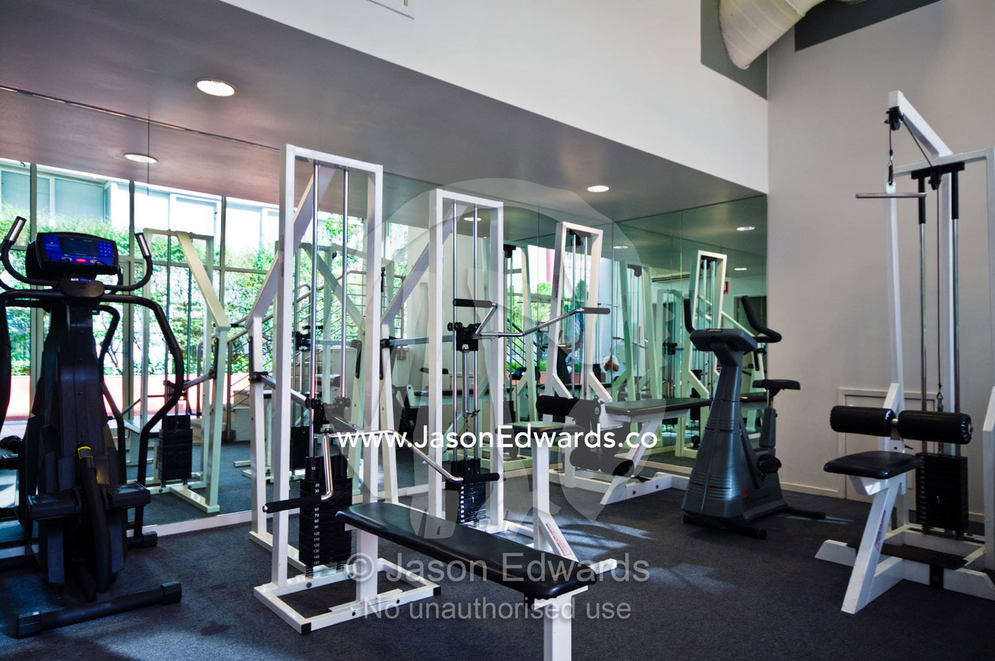 Exercise equipment in a private gymnasium in a city apartment complex. St Kilda Road, Melbourne, Victoria, Australia.
