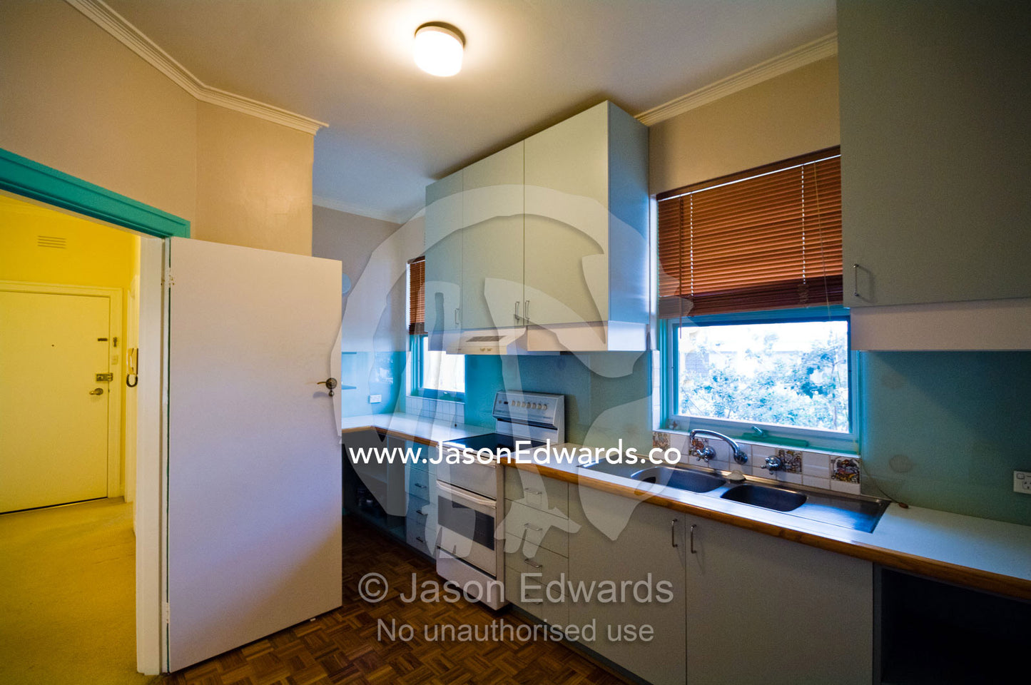 An empty kitchen in an uninhabited inner city art deco apartment. Parkeville, Melbourne, Victoria, Australia.