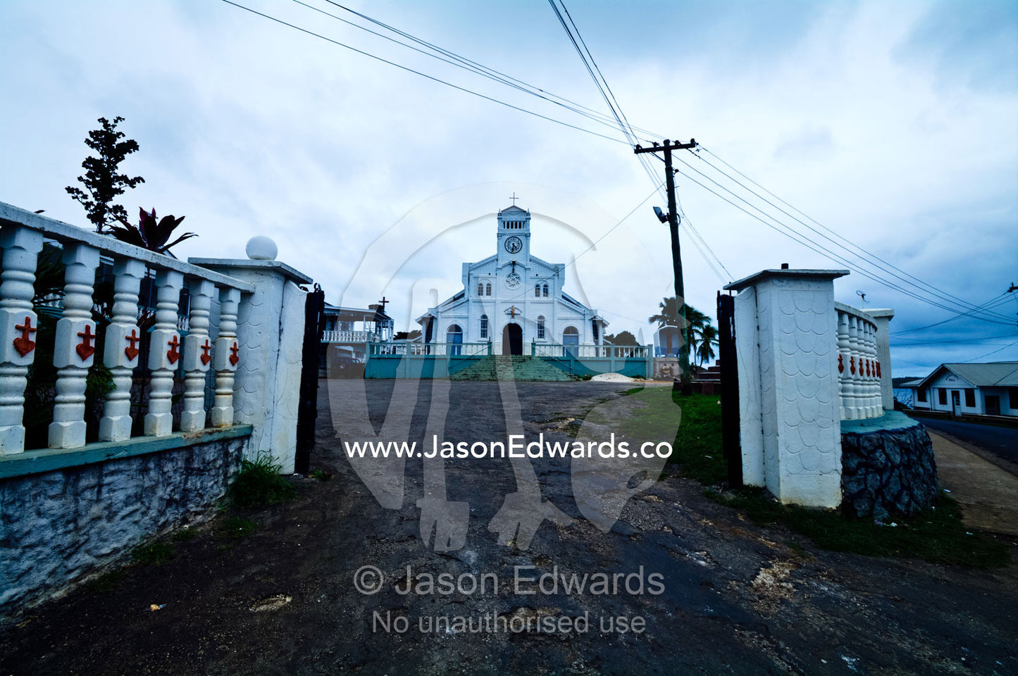 Gates lead to the entrance of St Joseph's Cathedral Catholic Church. Port of Refuge, Neiafu, Vava'u Island Group, Pacific Ocean, Oceania, Kingdom of Tonga.