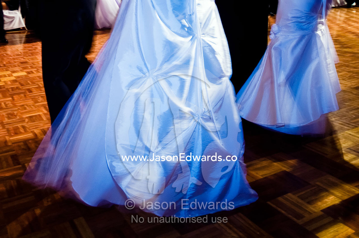Teenage girls in white dresses on the dance floor at a debutante ball. Melbourne, Victoria, Australia.