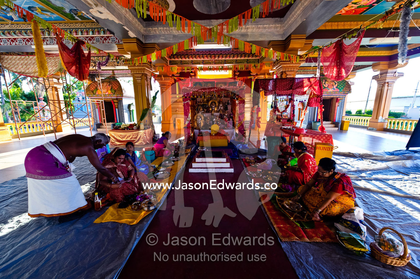 Women prepare intricate meals as prayer offerings in a Hindu temple. Sri Siva Subramaniya Swami Temple, Nadi, Pacific Ocean, Fiji Islands.