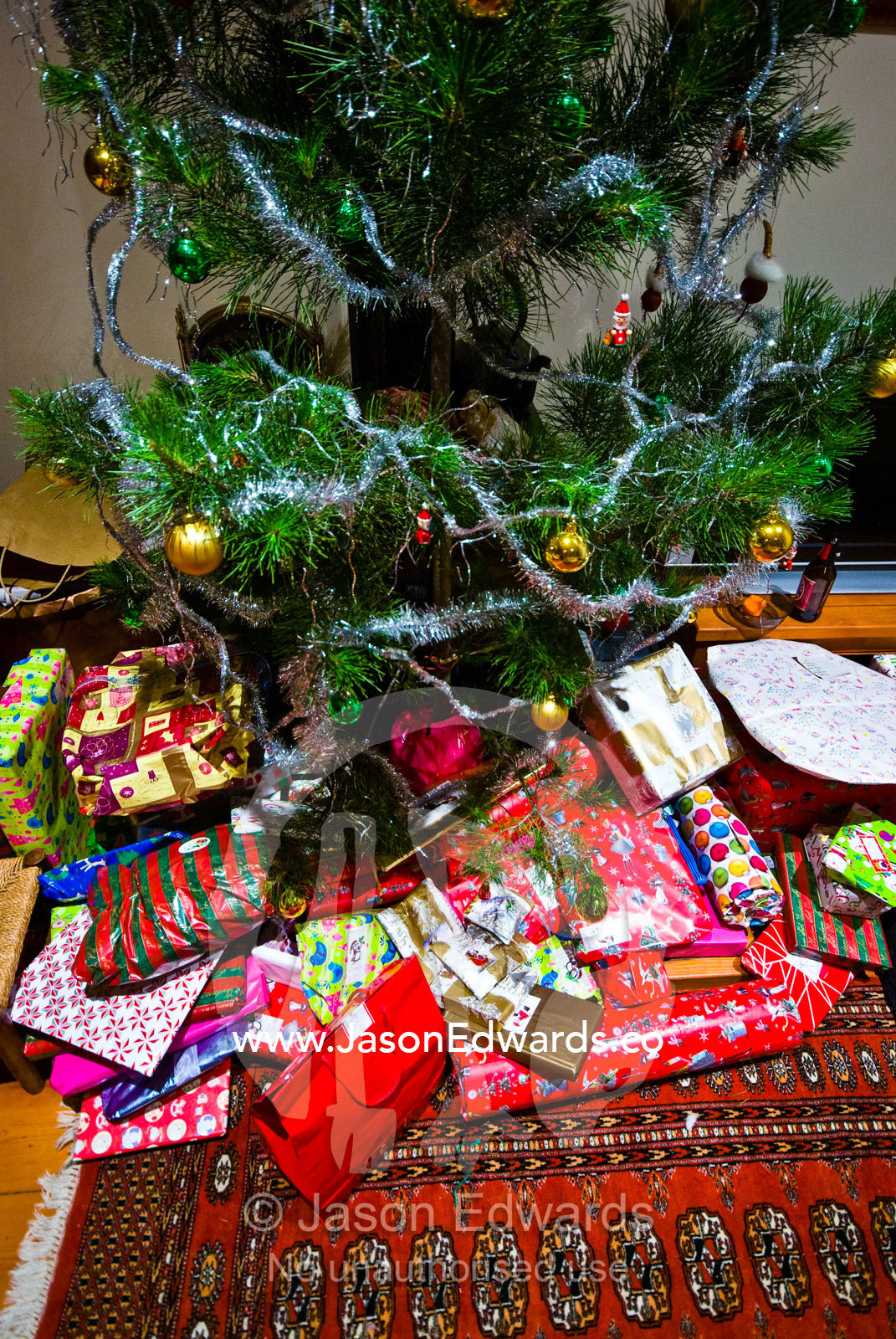 Gifts beneath a Christmas tree on Christmas Eve in a country town. Castlemaine, Victoria, Australia.