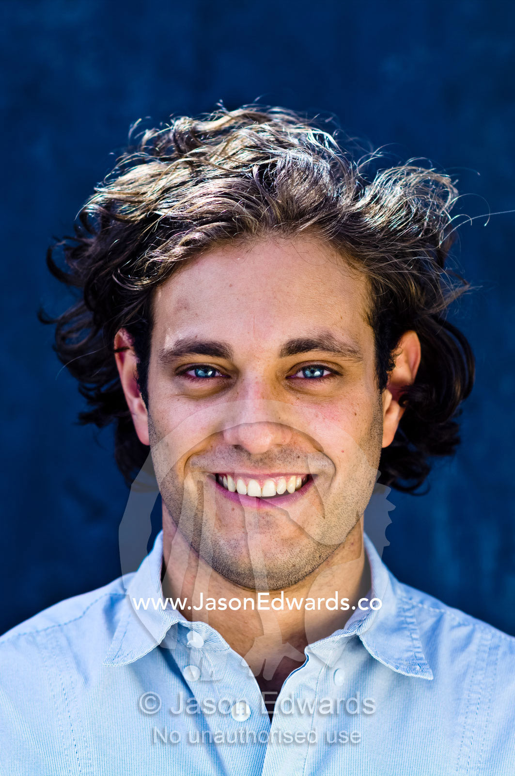 A portrait of a well-dressed young and attractive man smiling. Carlton, Melbourne, Victoria, Australia.