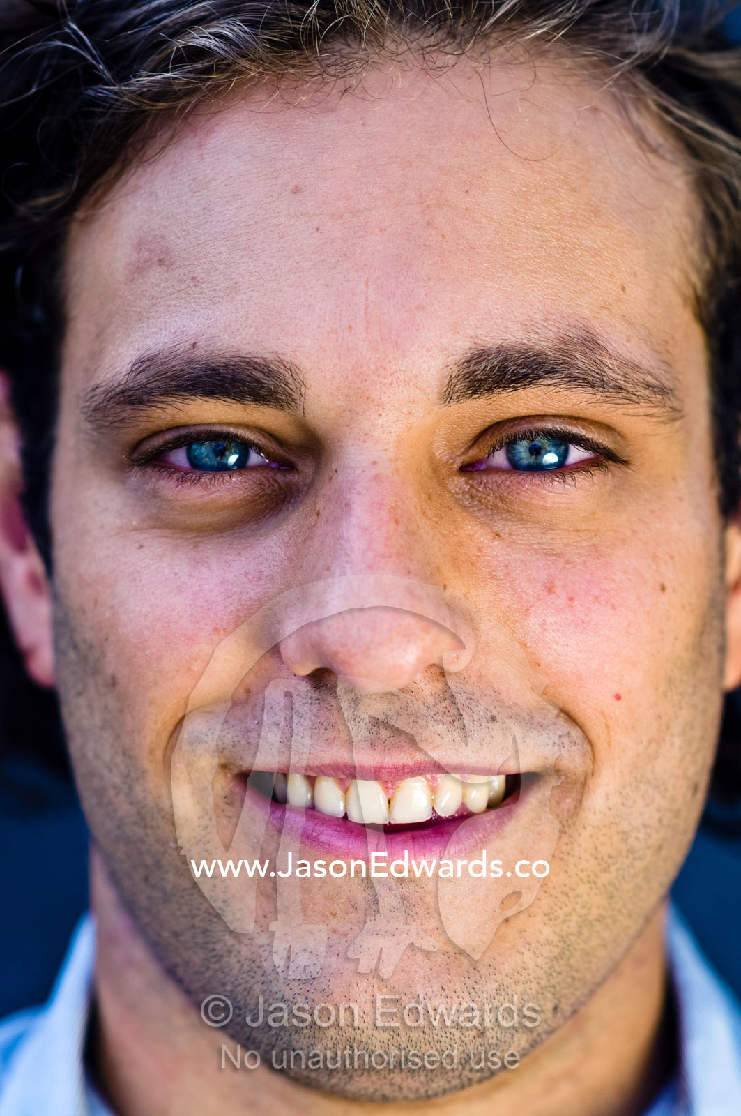 A portrait of a well-dressed young and attractive man smiling. Carlton, Melbourne, Victoria, Australia.