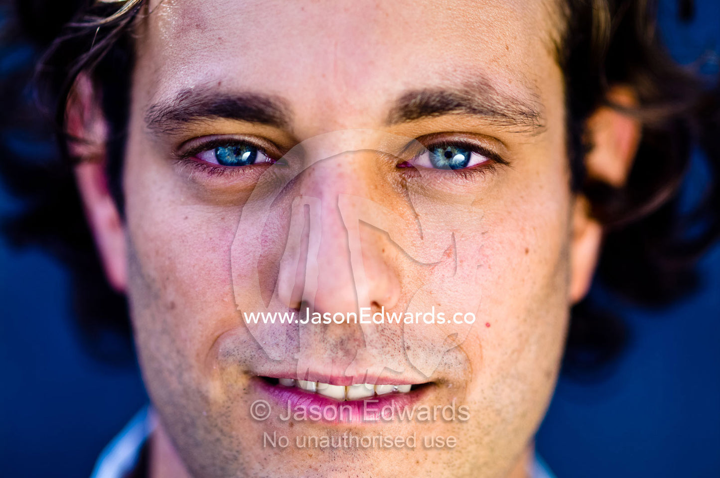 A portrait of a well-dressed young and attractive man smiling. Carlton, Melbourne, Victoria, Australia.