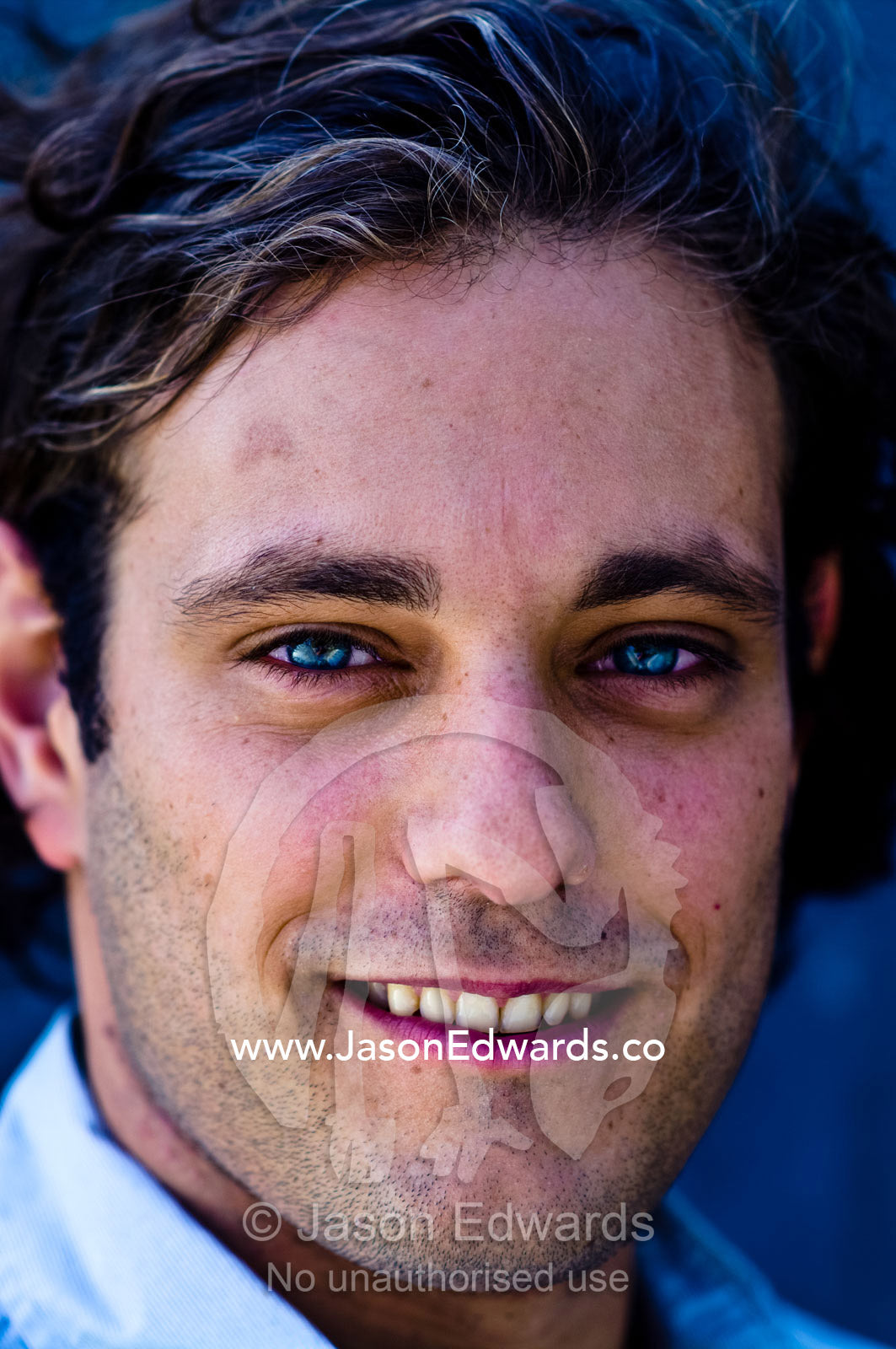 A portrait of a well-dressed young and attractive man smiling. Carlton, Melbourne, Victoria, Australia.