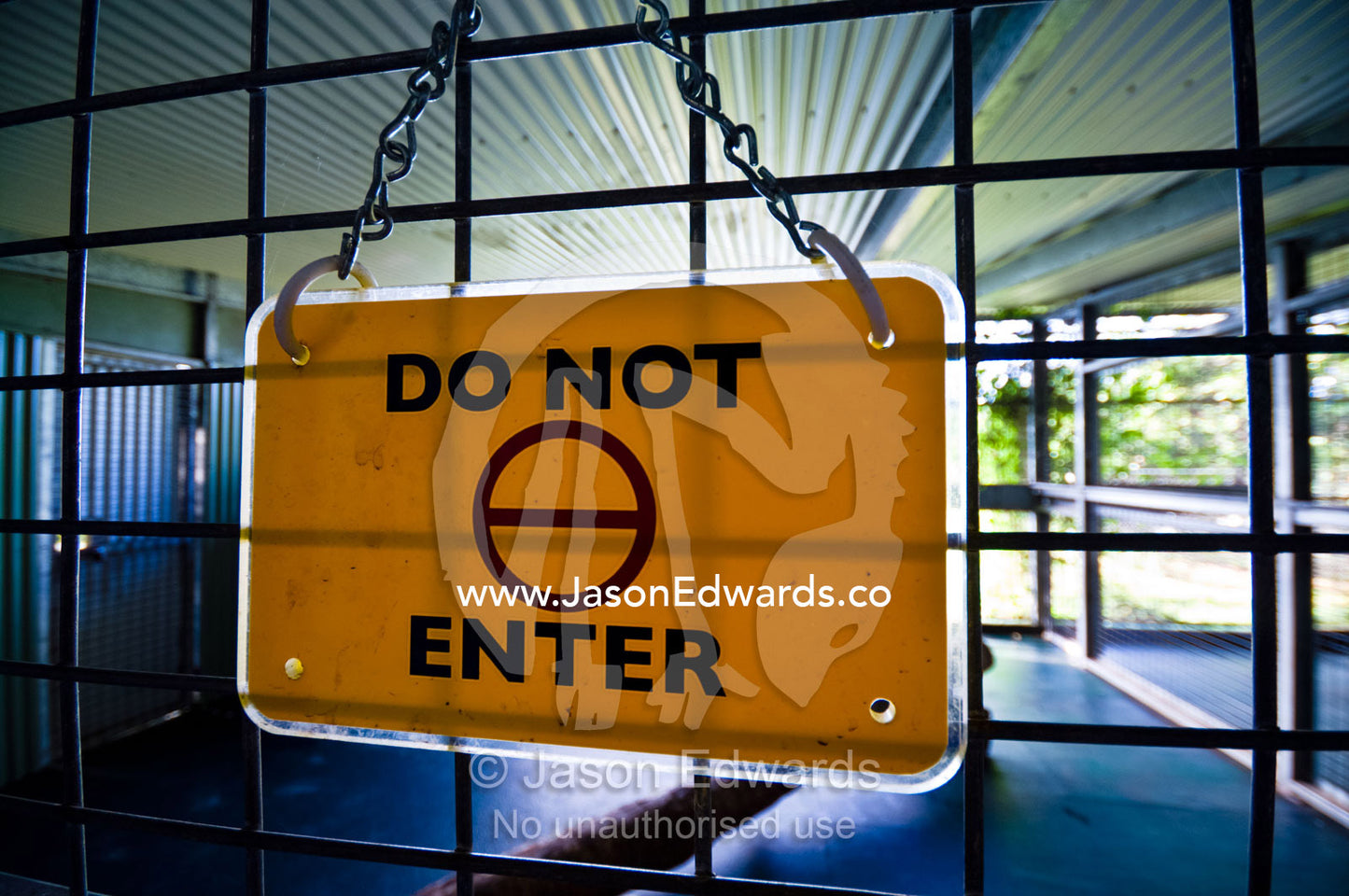 A safety warning sign on a Sumatran Tiger holding cage in a zoo. Australia Zoo, Beerwah, Queensland, Australia.
