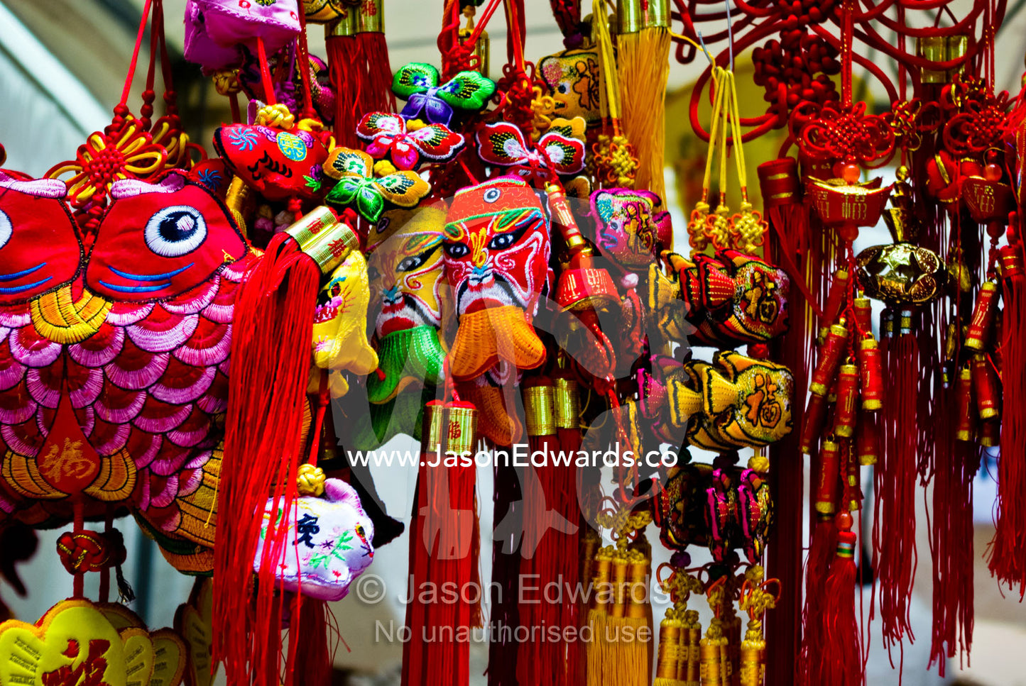 Kites, masks and woven hanging ornaments celebrate Chinese New Year. Chinatown, Melbourne, Victoria, Australia.