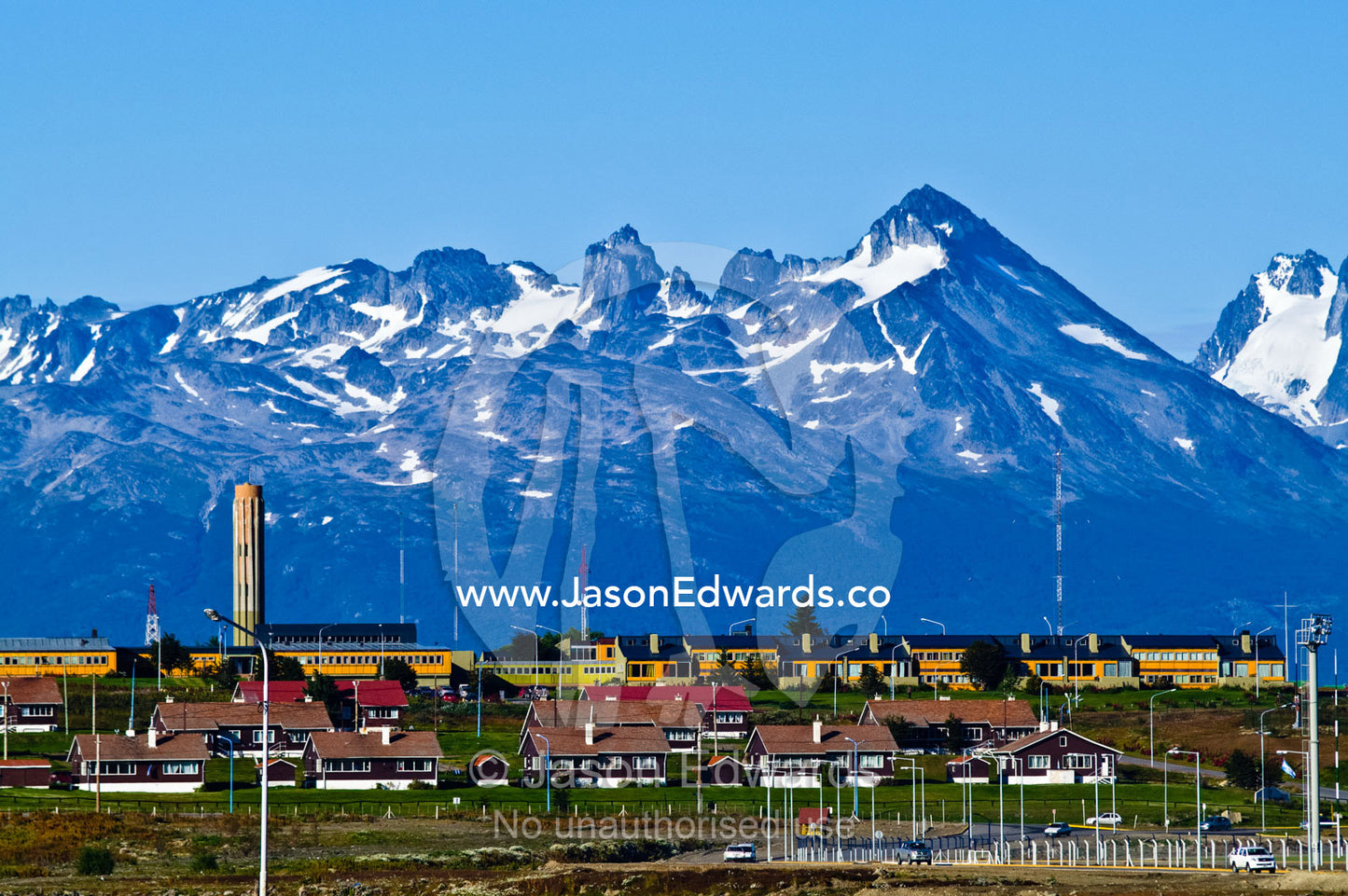 A community of homes, schools and offices beneath rugged alpine peaks. Ushuaia, Martial Mountains, Fuegian Andes, Ushuaia Bay, The Beagle Channel, Tierra del Fuego Archipelago, Straits of Magellan, Tierra del Fuego Province, Patagonia, Argentina.