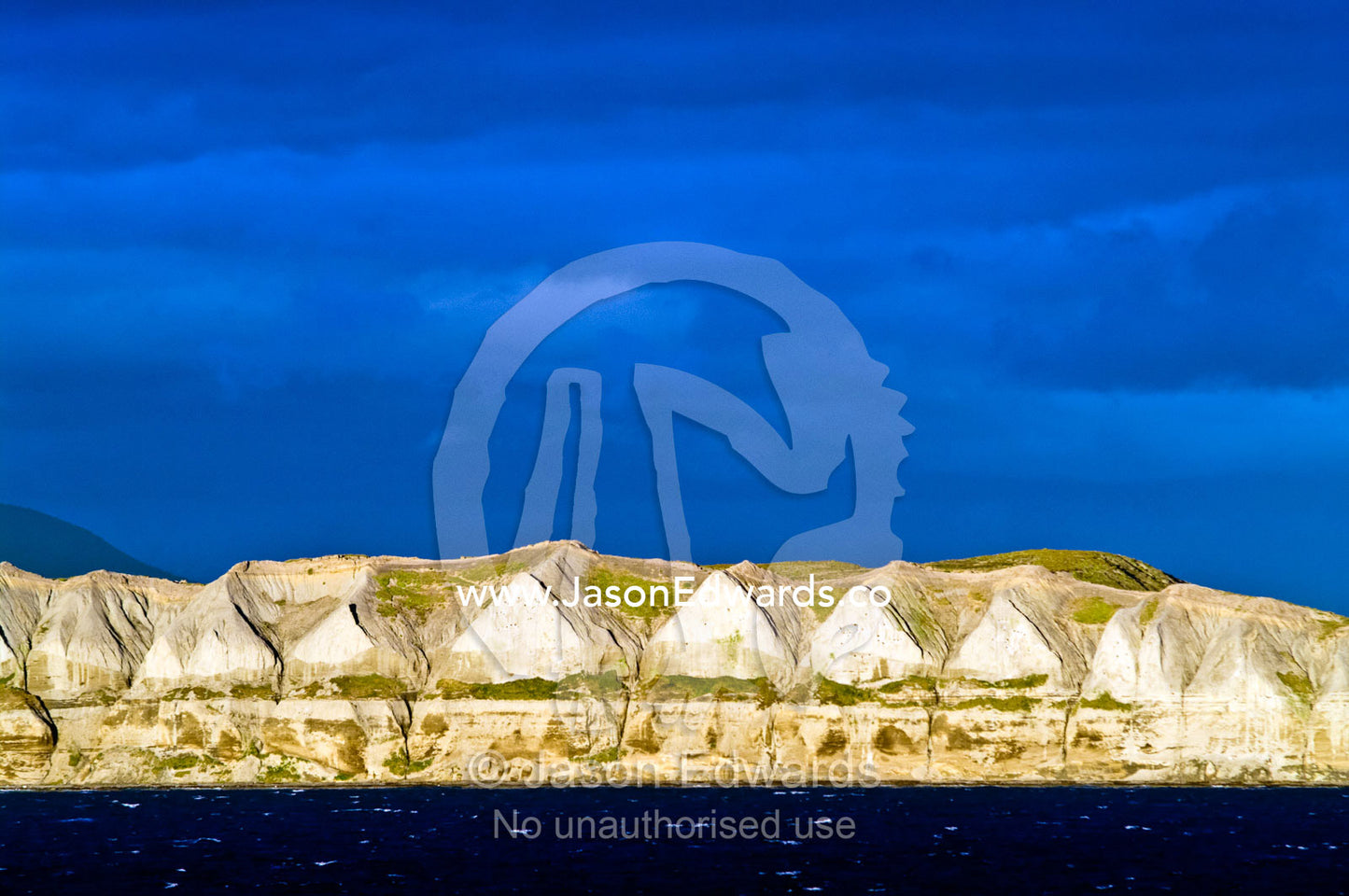Wind and rain erosion carves a cliff face into a row of pyramids. Ushuaia, Martial Mountains, Fuegian Andes, Ushuaia Bay, The Beagle Channel, Tierra del Fuego Archipelago, Straits of Magellan, Tierra del Fuego Province, Patagonia, Argentina.