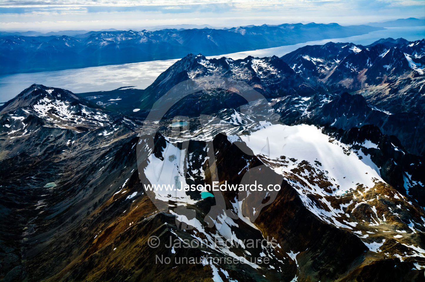 Ancient jagged inhospitable Andes peaks tower over Lago Fagnano. Cami Lake, Martial Mountains, Fuegian Andes, Tierra del Fuego Archipelago, Straits of Magellan, Tierra del Fuego Province, Patagonia, Argentina.