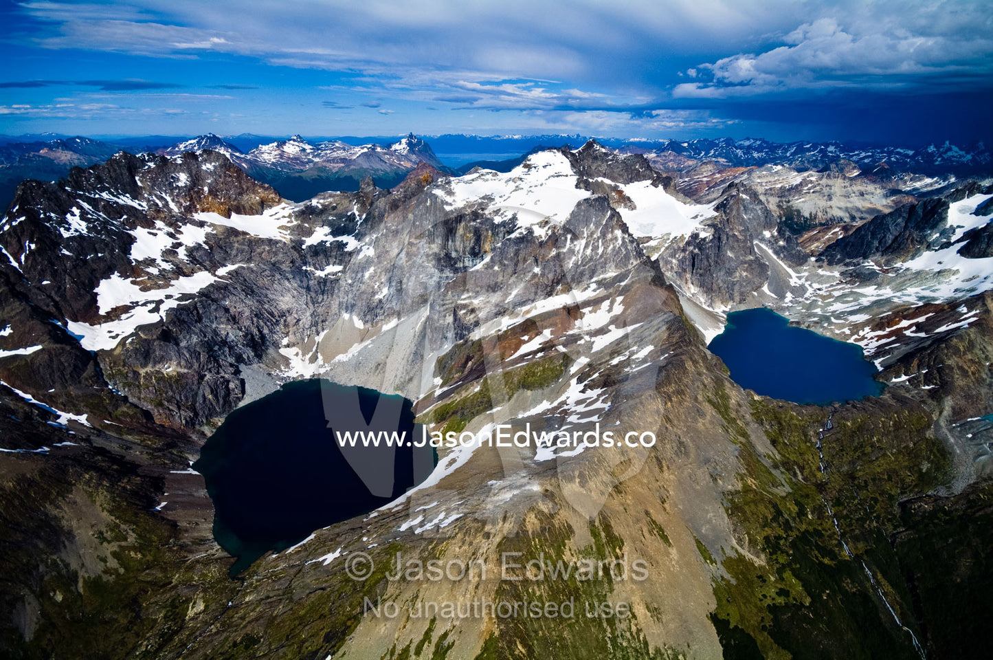 Snow and ice draped peaks cradle two remote turquoise glacial lakes. Martial Mountains, Fuegian Andes, Tierra del Fuego Archipelago, Strait of Magellan, Tierra del Fuego Province, Patagonia, Argentina.