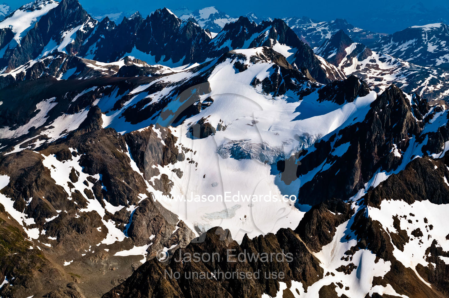 The rugged, inhospitable spine of the Andes covered in snow and ice. Ushuaia, Martial Mountains, Fuegian Andes, Tierra del Fuego Archipelago, Straits of Magellan, Tierra del Fuego Province, Patagonia, Argentina.
