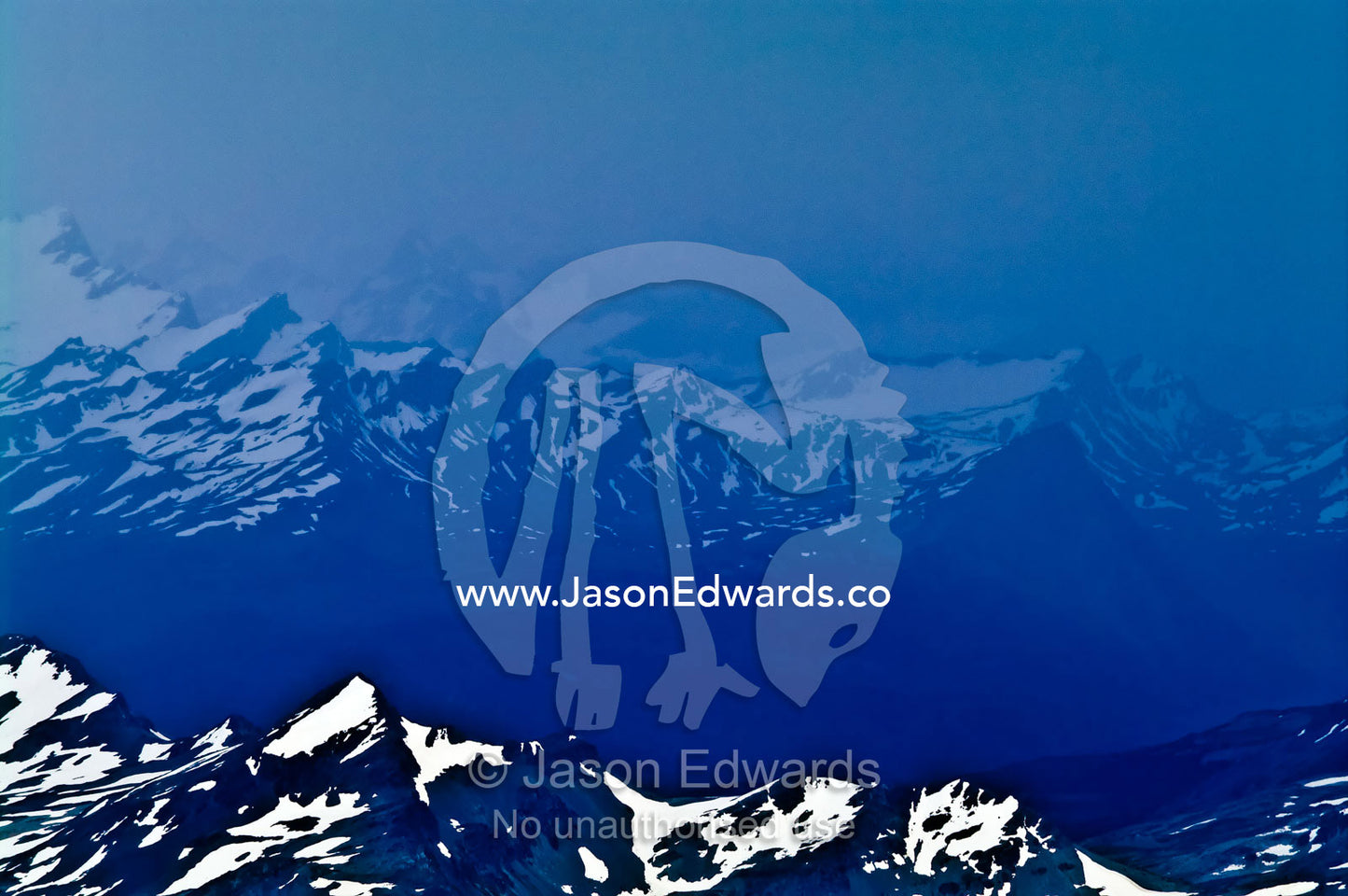 A winter storm engulfs the spine of the Andes covered in snow and ice. Ushuaia, Martial Mountains, Fuegian Andes, Tierra del Fuego Archipelago, Straits of Magellan, Tierra del Fuego Province, Patagonia, Argentina.
