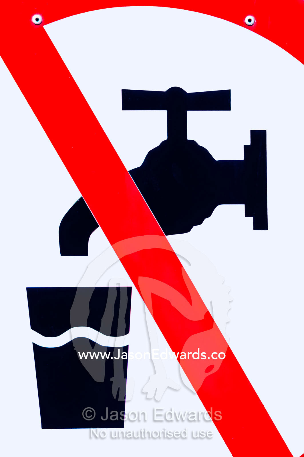 A red warning sign indicates the danger in drinking bore water. Venus Bay, South Gippsland, Victoria, Australia.