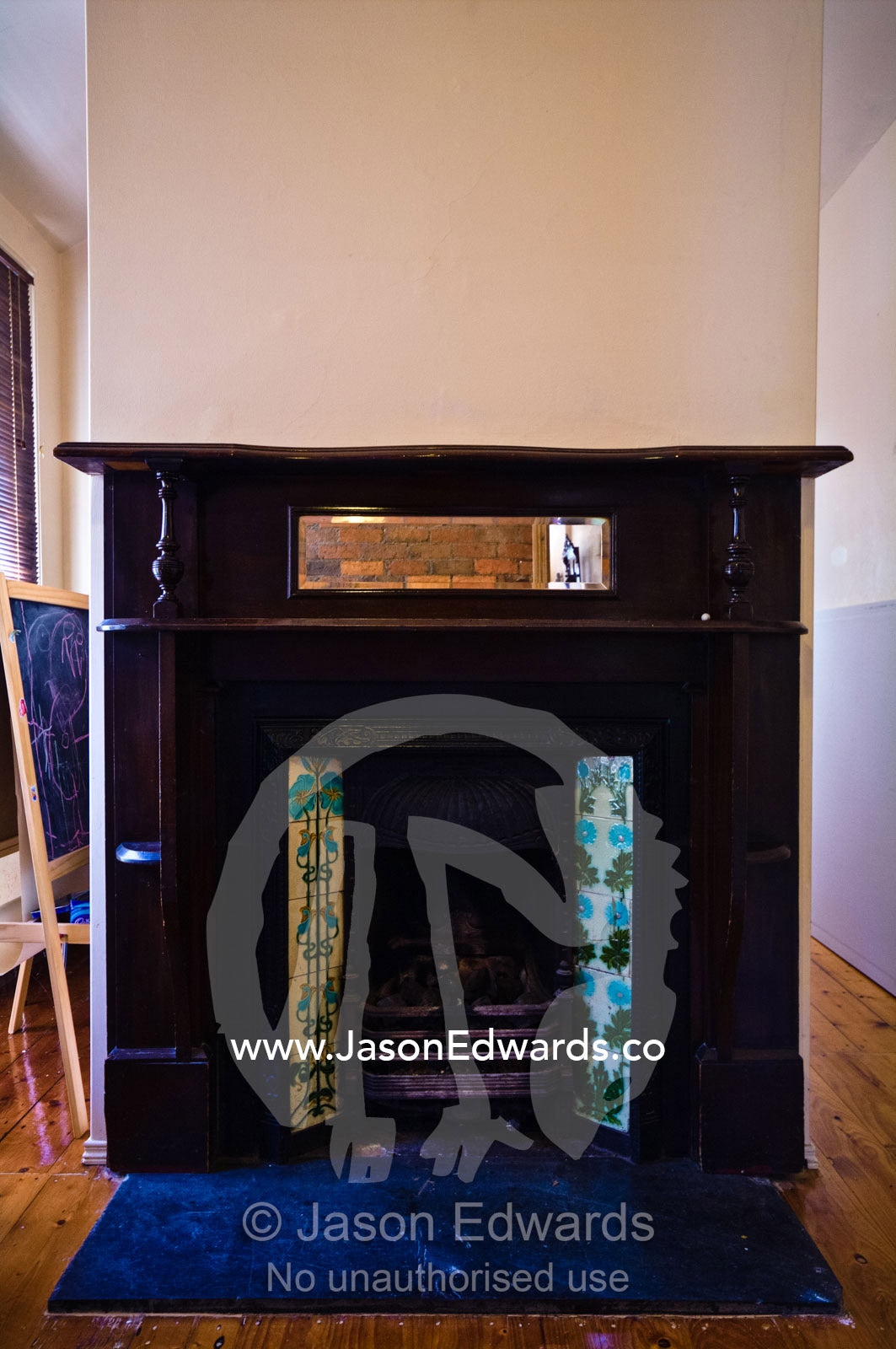An antique heritage Victorian hearth, fireplace, chimney and mantel. Carlton North, Melbourne, Victoria, Australia.