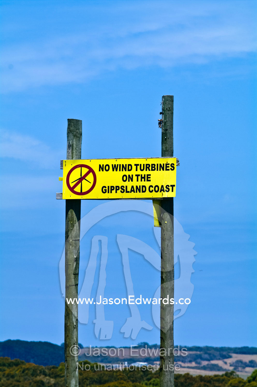 Protest sign banning wind turbines in a coastal farming community. Walkerville, Cape Liptrap Coastal Park, Bass Strait, South Gippsland, Victoria, Australia.
