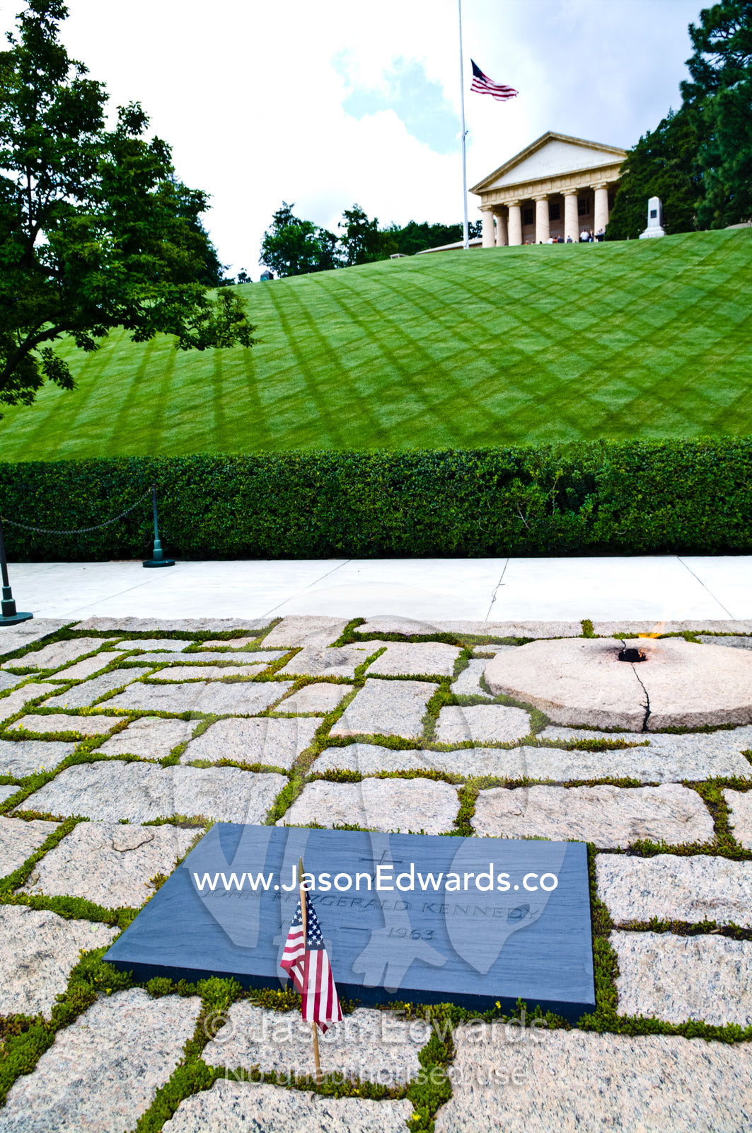 A flag at the grave of President John F. Kennedy on Memorial Day. Arlington National Cemetery, Arlington, Virginia, United States of America.