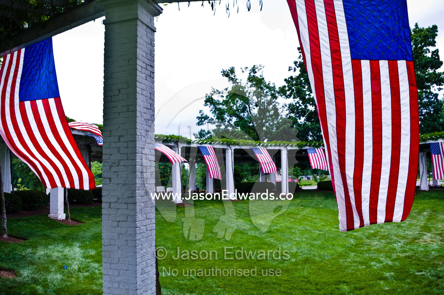 American flags surround the Old Amphitheater on Memorial Day. Old Amphitheater and Rostrum, Arlington National Cemetery, Arlington, Virginia, United States of America.