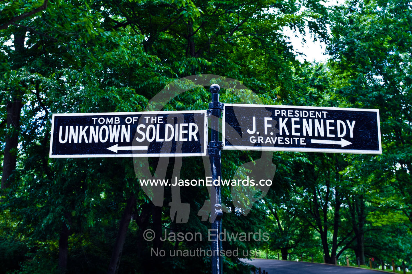 Signs direct visitors to specific graves and tombs at the cemetery. Arlington National Cemetery, Arlington, Virginia, United States of America.
