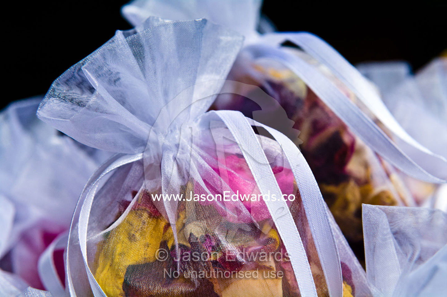 Dried rose petal potpourri used as bride confetti at a garden wedding. Park Orchards, Melbourne, Victoria, Australia.