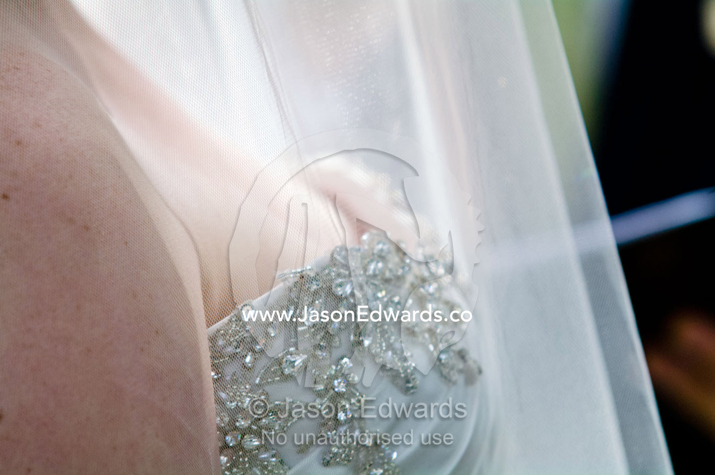 Tulle veil and rhinestone applique upon the bust of a bridal gown Park Orchards, Melbourne, Victoria, Australia.