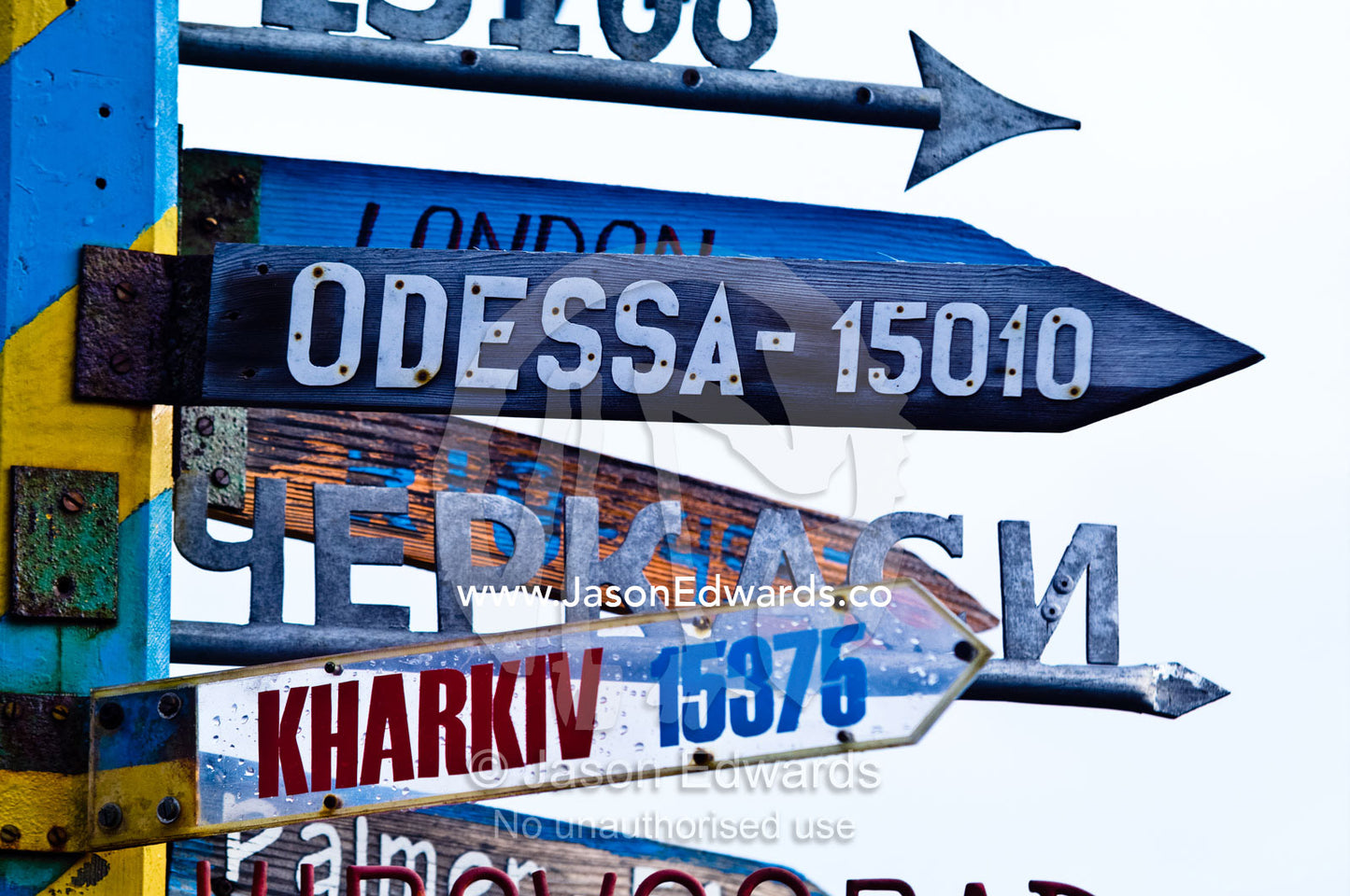 A directional sign at a Ukrainian station points to distant cities. Vernadsky Antarctic Research Base, Galindez Island, Argentine Islands, Faraday Islands, Antarctic Peninsula, Antarctica.