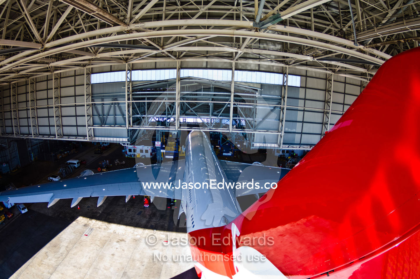Jet airliner garaged in an airport hanger for repairs and maintenance. Kingsford Smith Airport, Mascot, Sydney, New South Wales, Australia.