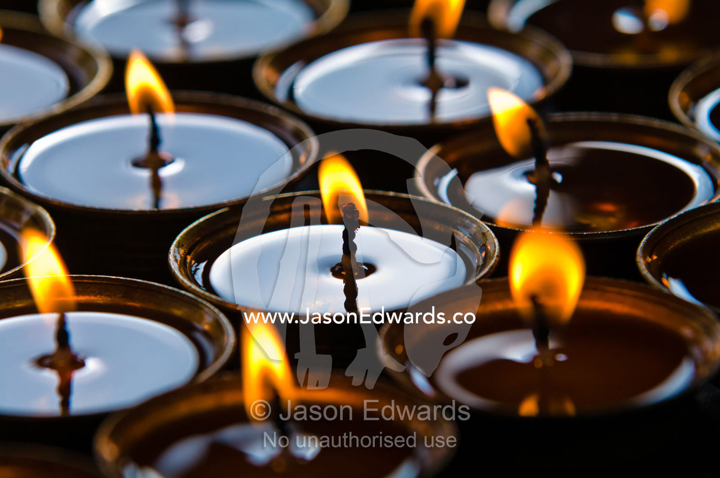 Prayer butter lamps flickering in a tranquil Buddhist monastery. Thimphu Memorial Chorten, Thimphu, Bhutan.