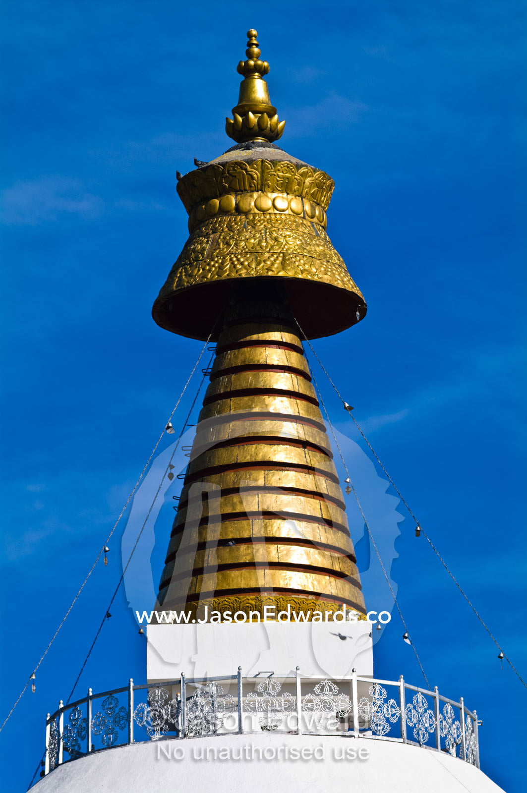 The Thimpu Memorial Chorten is famous for its golden spires and bells which reflect the bright sun. Thimphu Memorial Chorten, Thimphu Bhutan.