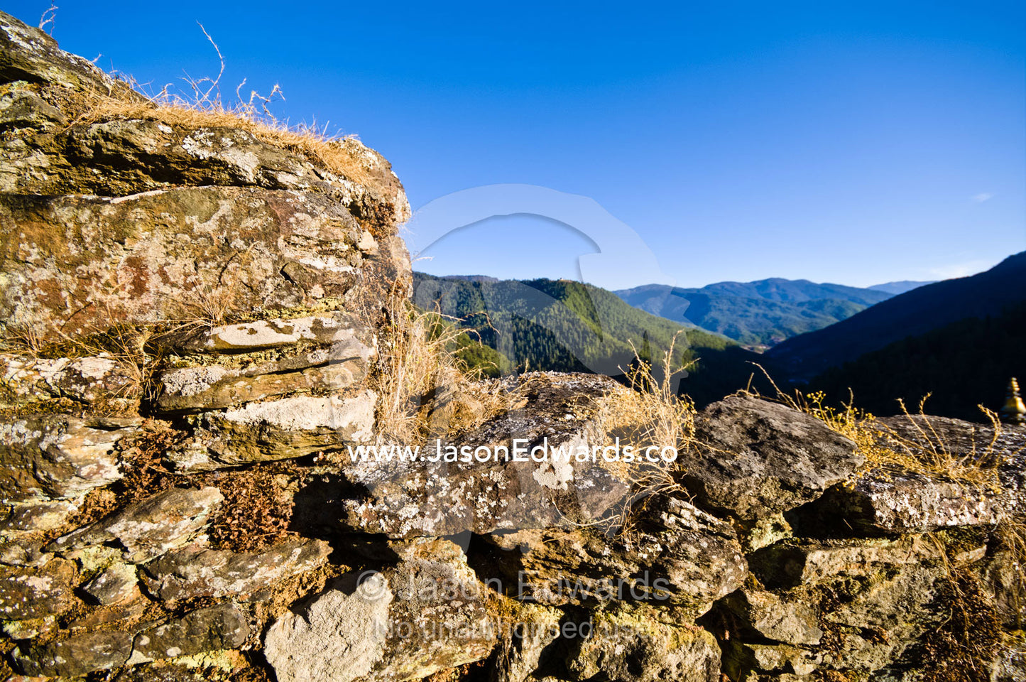 Ancient crumbling handmade steps leading up a Himalayan valley to a Buddhist monastery. Cheri Monastery, Chagri Dorjeden Monastery, Thimphu, Thimphu District, Bhutan.