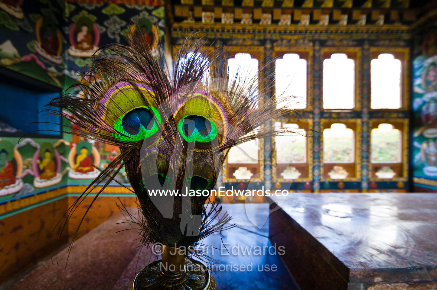 Peacock feathers displayed in a bronze vase inside a Buddhist temple. 108 Druk Wangyal Khangzang Chortens, Dochula Pass, Thimphu District, Bhutan.