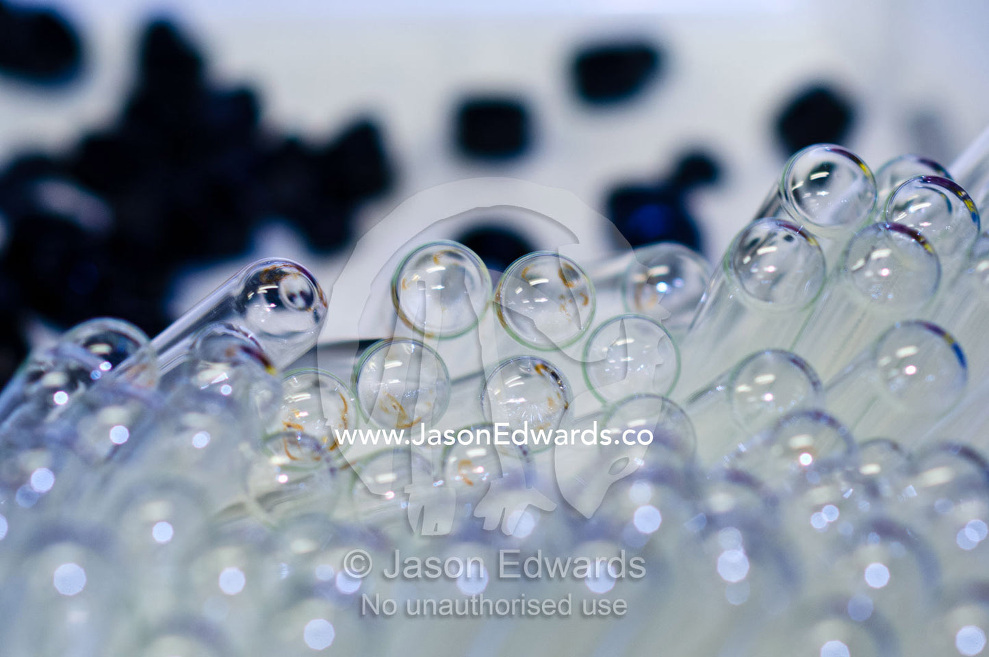 A pile of glass vials used for experiments in a research laboratory. Bio21 Molecular Science and Biotechnology Institute, University of Melbourne, Parkville, Melbourne, Victoria, Australia.