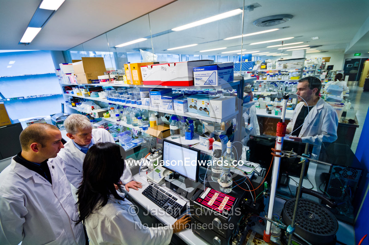 Scientists experiment on a fast protein liquid chromatography system. Bio21 Molecular Science and Biotechnology Institute, University of Melbourne, Parkville, Melbourne, Victoria, Australia.