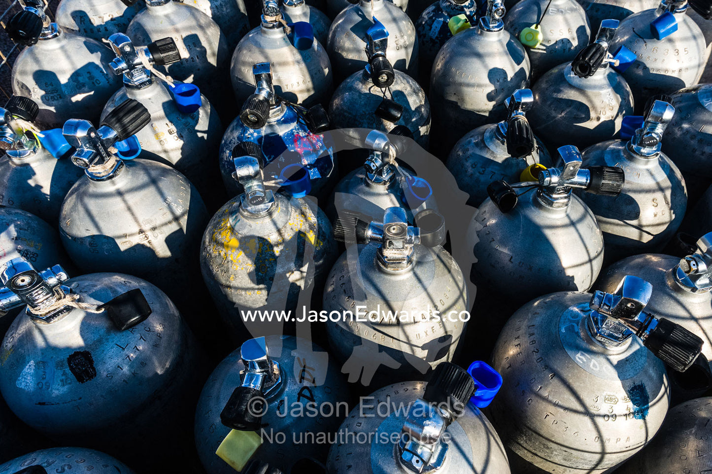 A collection of scuba diving oxygen tanks in a steel cage. Exmouth, Ningaloo Reef, Ningaloo Marine Park, World Heritage Site, Western Australia, Australia.