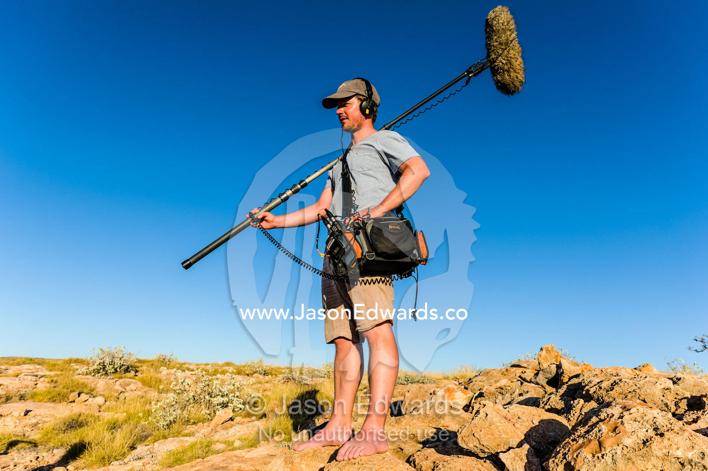 A sound engineer with his microphone and recording equipment. Cape Range National Park, Exmouth, Ningaloo Reef, Western Australia, Australia.