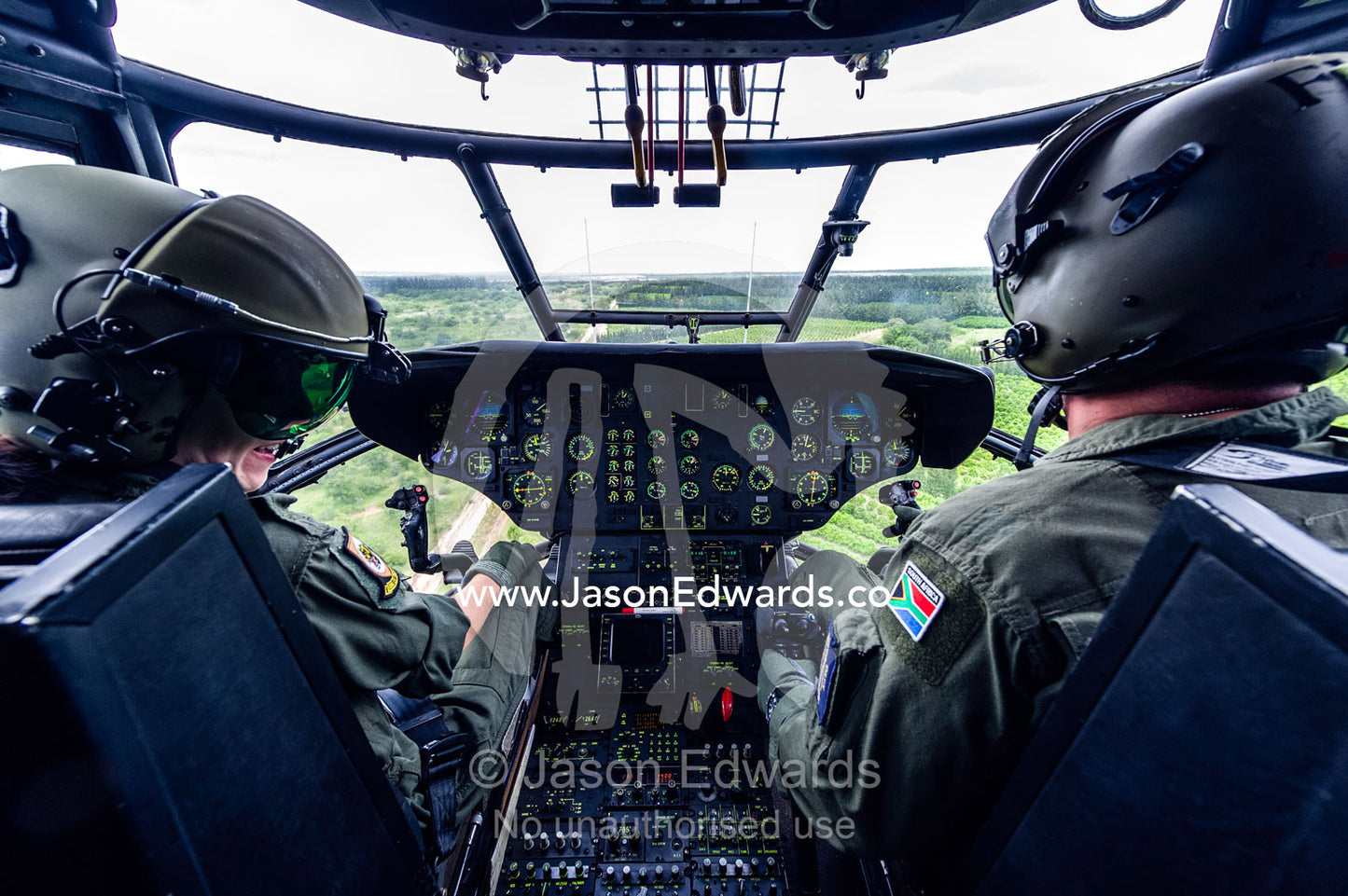 The pilot flight crew of an Atlas Oryx airforce helicopter on patrol. Kruger National Park, South Africa.
