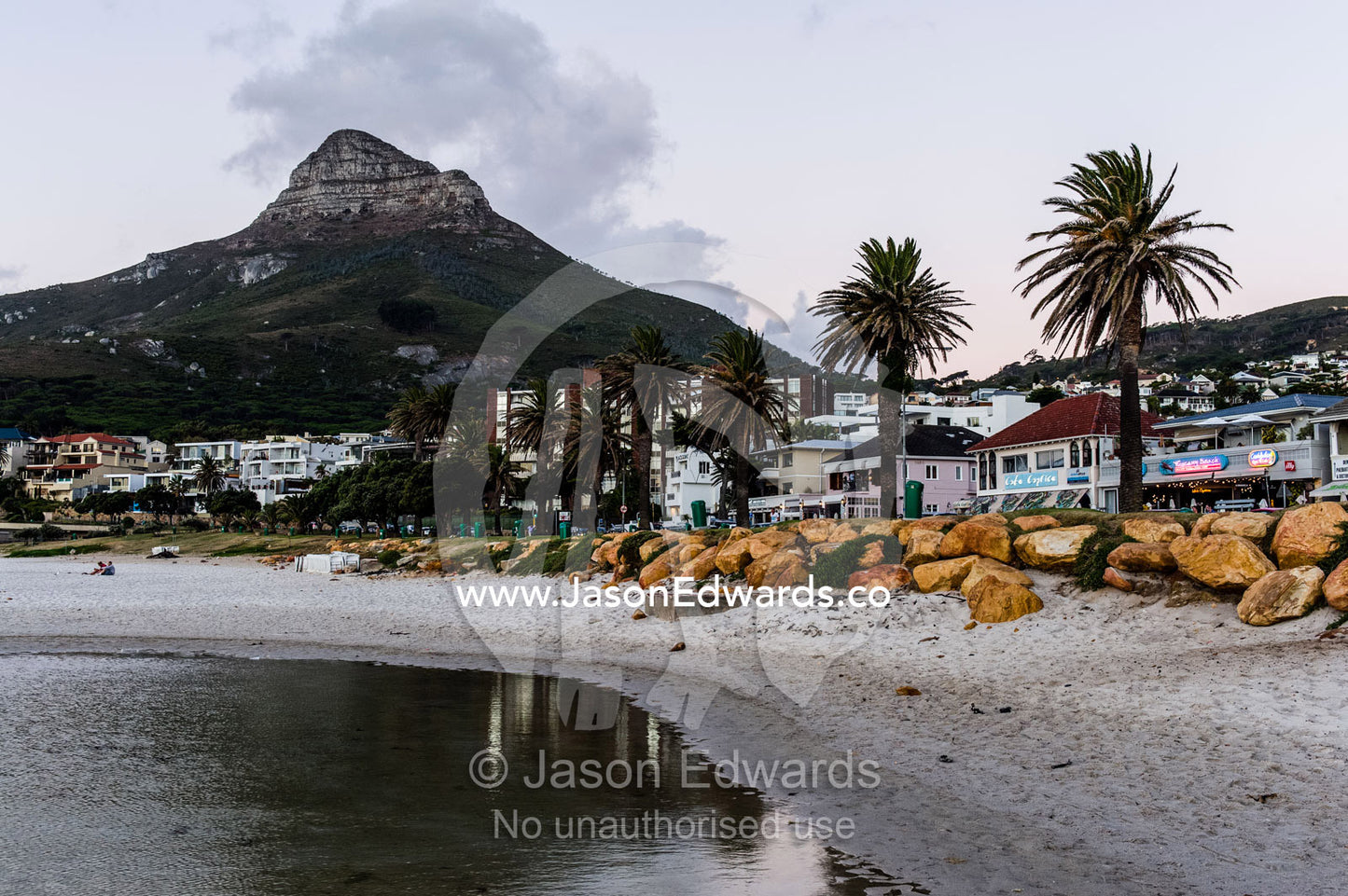 Restaurants line the foreshore of a small coastal town. Bantry Bay, Cape Town, Western Cape, South Africa.