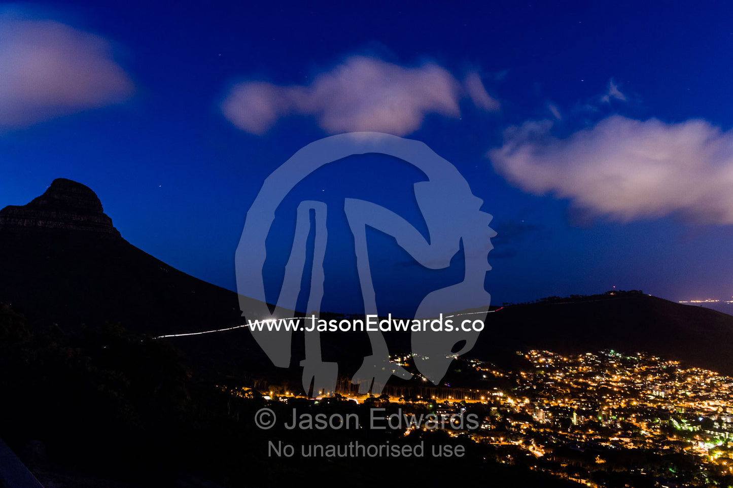Cape Town's sprawling suburbs, harbor and shopping district at night. Table Mountain, Cape Town, Cape Peninsula, Western Cape, South Africa.
